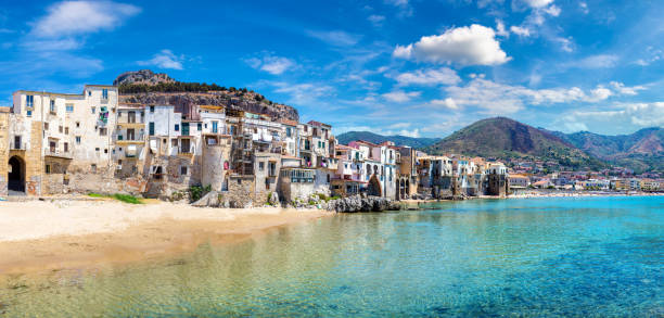 istock Sandy beach in Cefalu in Sicily 1265242797