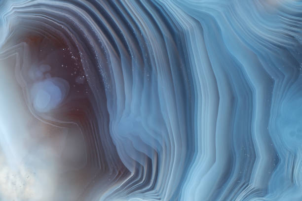 istock Full-screen texture of natural red-blue agate stone with a smooth layered pattern 1265243124
