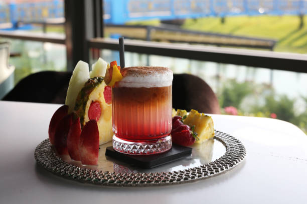istock various fruits alongside a fruit cocktail 1265245081