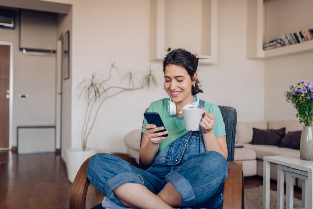 Girl enjoying at home and surfing the net stock photo