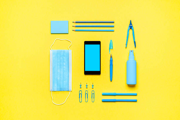 istock School supplies, protective mask and hand sanitizer. Back to school new rules 1265249403