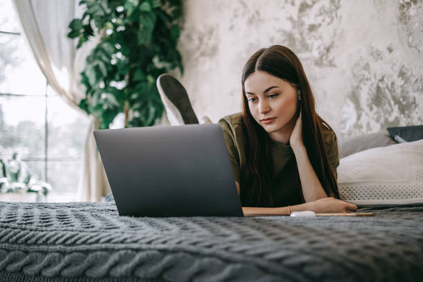 istock Attractive young caucasian woman working with laptop computer 1265249631