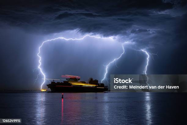 Sailing Ship During A Severe Lightning Storm Stock Photo - Download Image Now - Storm, Container Ship, Cruise Ship