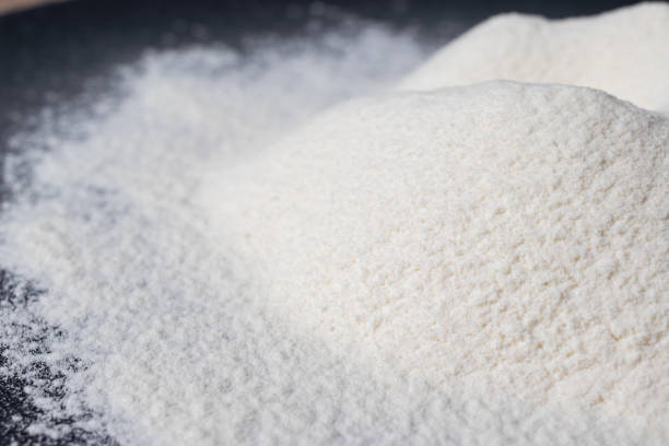 istock Wheat white flour on a black plate. Making bread and baked goods. 1265250837