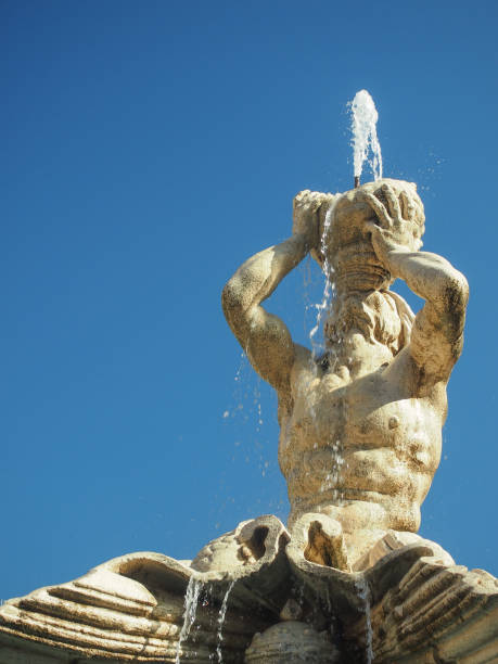 Triton A shot of the Triton fountain in Rome, Italy on a clear day on October 2014 triton greek god stock pictures, royalty-free photos & images