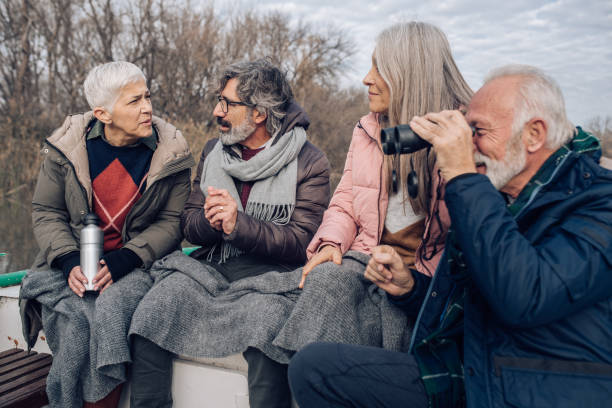 istock Seniors enjoying sailing the river and exploring the the environment 1265253236