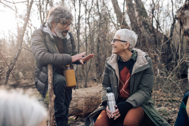 istock Seniors resting while hiking and talking about their adventures 1265253414