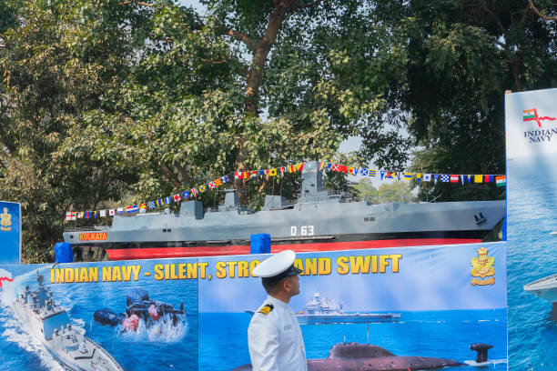 India navy displaying submarine at Republic day. Kolkata, West Bengal, India - 26th January 2020 : Indian naval officer looking at a model submarine, in Republic day parade at Red Road. Display by Indian naval force. indian navy stock pictures, royalty-free photos & images
