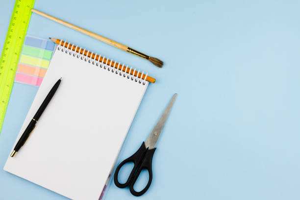 istock School supplies on a light blue background. 1265255951
