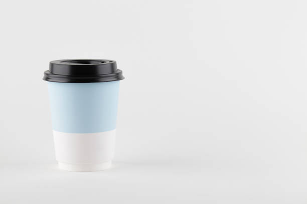 istock take away paper cup for coffee or tea on white background. copy space 1265257482