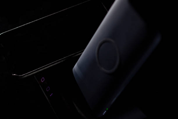 istock Wireless charging unit and smartphone together with a power bank 1265259193