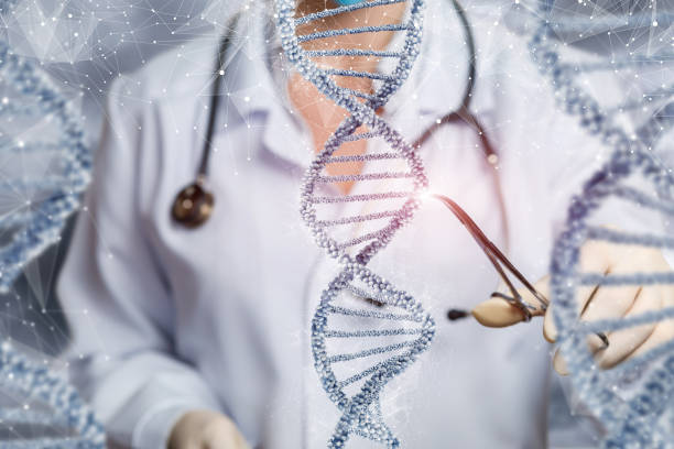 The doctor examines the DNA molecule with a clamp . The doctor examines the DNA molecule with a clamp on a blurred background. gene editing stock pictures, royalty-free photos & images