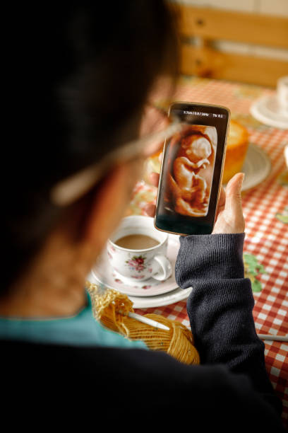 istock grandmother looking at baby 3d image 1265270818