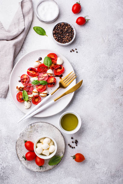 istock Caprese salad with tomatoes and mozzarella 1265271113
