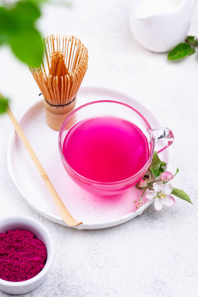 Pink matcha tea from dragon fruit Pink matcha tea. Trendy drink from dragon fruit powder dragon fruit flower stock pictures, royalty-free photos & images