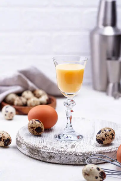 Glass of egg liquor and quail eggs