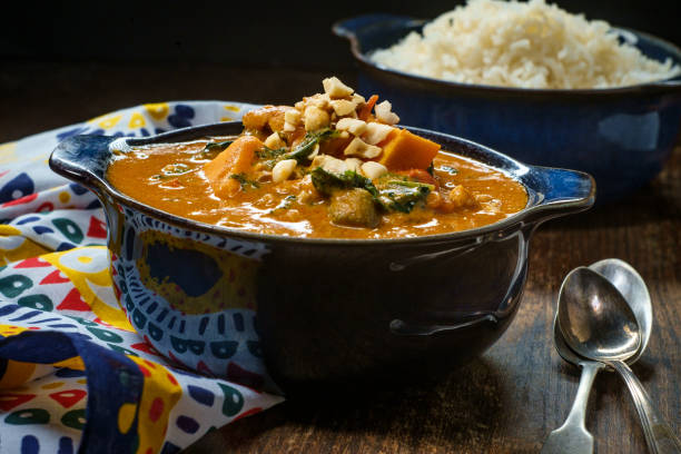 African Chicken Peanut Stew African chicken peanut stew with sweet potatoes and okra with side of basmati rice african culture food stock pictures, royalty-free photos & images