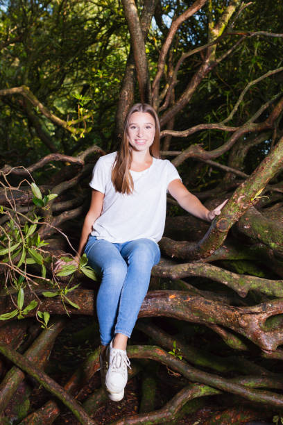 istock Young lady climbing in the woods 1265274488