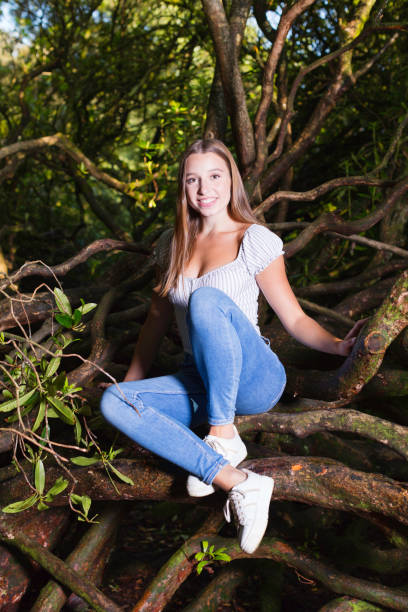 istock Young lady climbing in the woods 1265274539