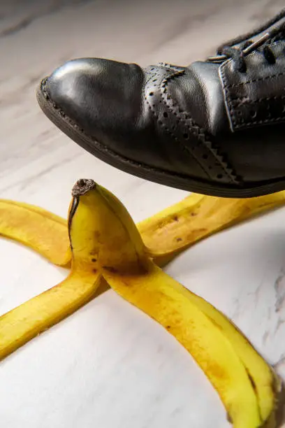 Comedy slippery banana peel with womens jazz shoe about to step on it
