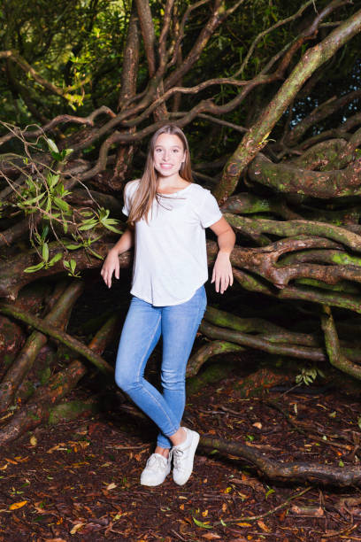 istock Young lady standing in the woods 1265275204