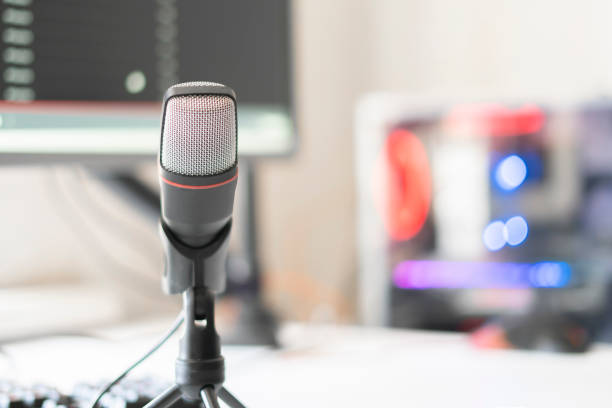 istock the microphone and computer in the radio studio, recording speach live 1265279639