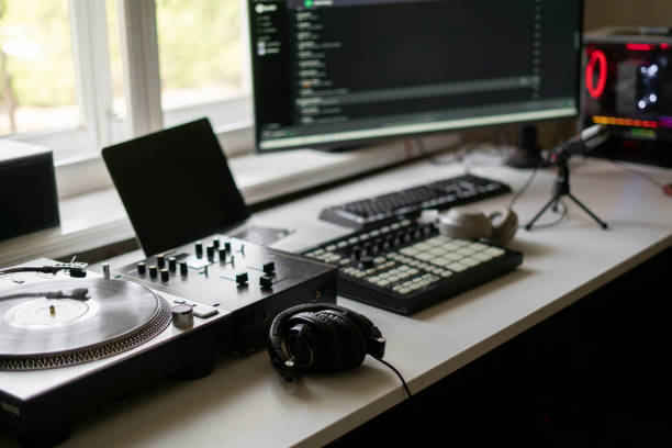 istock small music production studio equipment close up, record player, midi drum pad mixer and microphone 1265279814