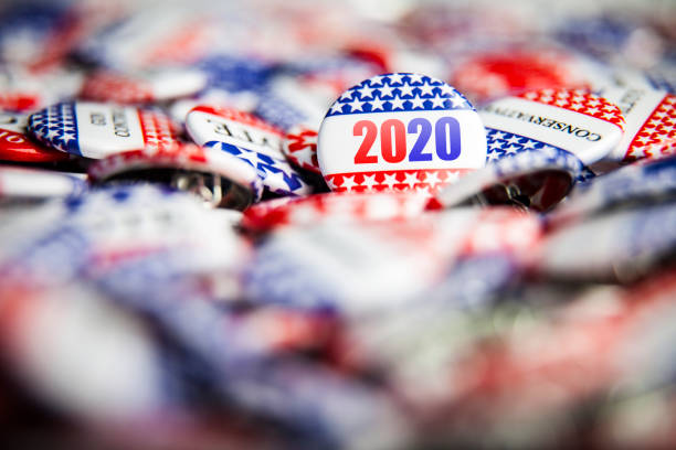 Election Vote Buttons 2020 Closeup of election vote button with text that says 2020 primary election photos stock pictures, royalty-free photos & images