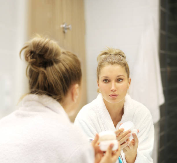 istock Magic anti-aging cream.Applying the cream 1265288841