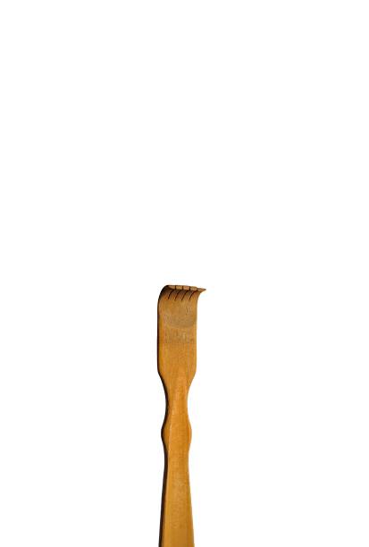 istock Bamboo wood back scratcher on white background 1265292183