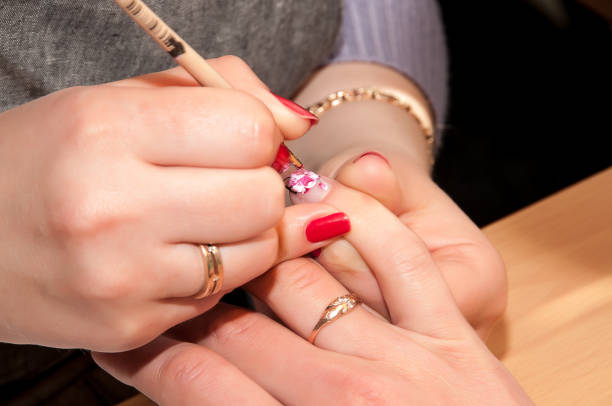 istock Manicure. Drawing a picture on a nail 1265297176