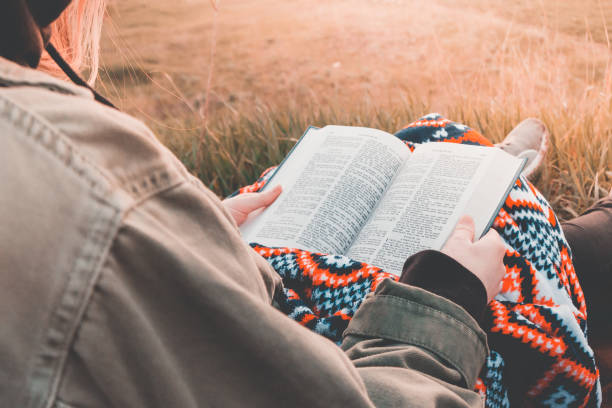istock girl reads the bible 1265297283