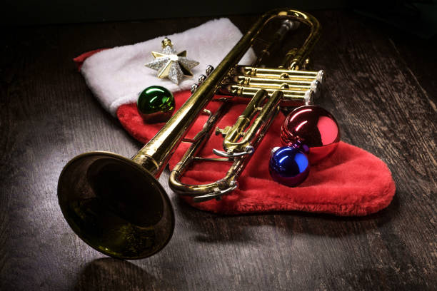 Seasonal Christmas and the holidays musical instrument trumpet with dramatic lighting