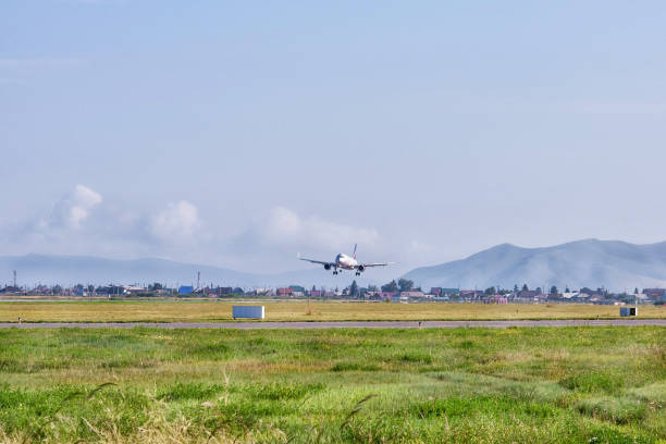 istock A big silver jet landing on a runway. 1265299753