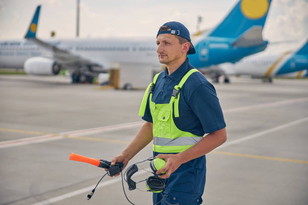 istock Airport worker gazing fixedly into the distance 1265300145