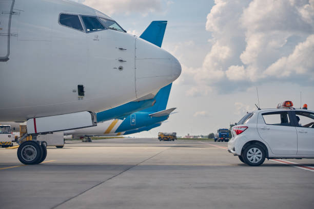 istock Ground vehicle leading the newly arrived plane 1265300204