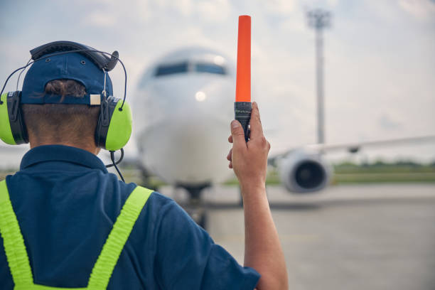 istock Male worker holding the raised right hand 1265300210