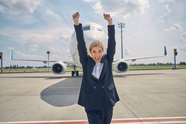 istock Cute cheerful lady standing on the runway 1265304583