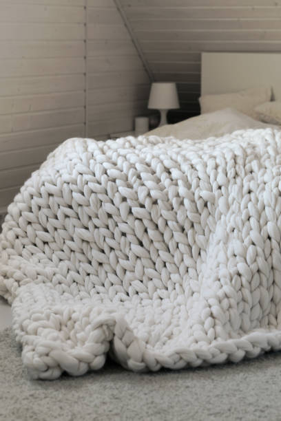 istock White scandinavian interior with knit plaid. 1265313556