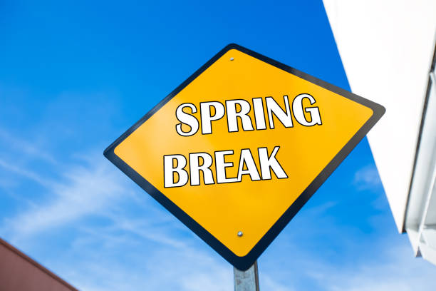 istock Words Spring Break on yellow road sign 1265313577