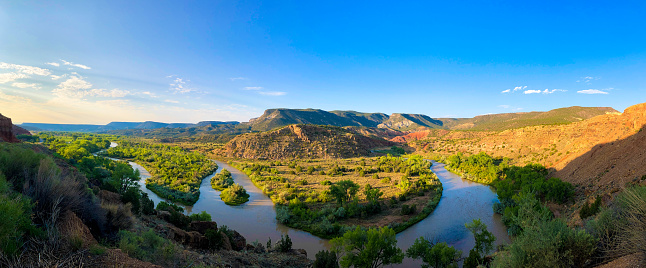 Abiquiu, NM: Overlooking the Rio Chama on summer morning Abiquiu, 50 miles north of Santa Fe, was home to Georgia O’Keeffe; she painted this landscape.