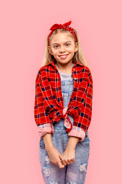 istock Kid girl looking at camera and smiling wide 1265315684