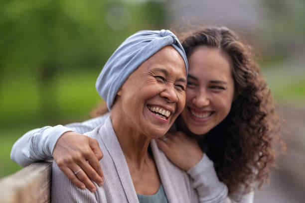 istock Mother and daughter laughing together 1265315823