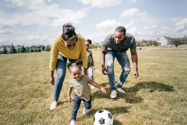 istock Positive parenting - playing soccer with little once 1265316010