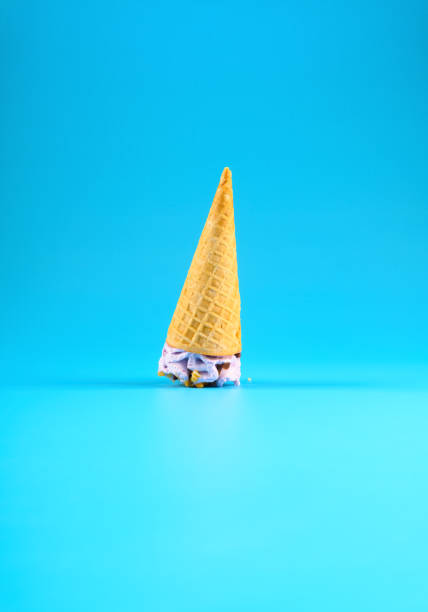 istock sweet potato flavor ice cream cone stands upside down on a blue background 1265316599