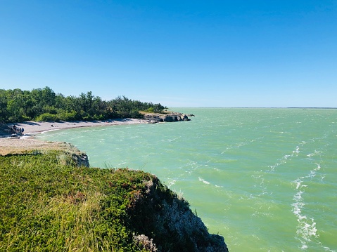 The cliffs and green water make Steep Rock, Manitoba a tourist destination every summer. Steep Rock is located appropriately 2.5 hours from Winnipeg, on Lake Manitoba.