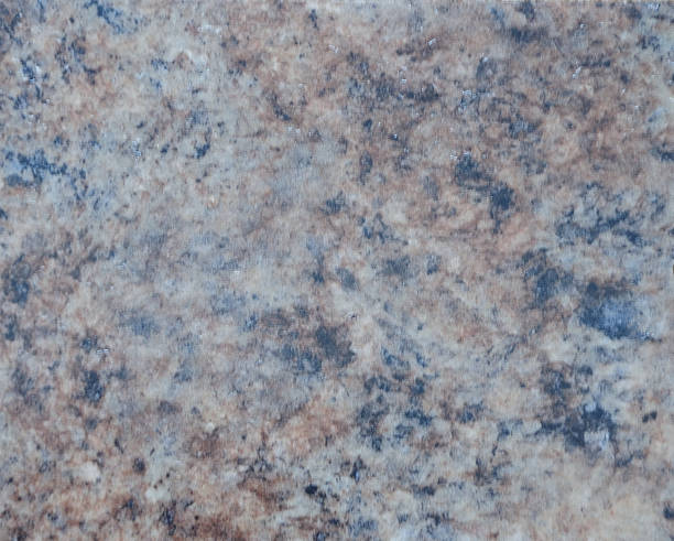 istock Dark granite, a natural stone with a rich close-up pattern. 1265335392
