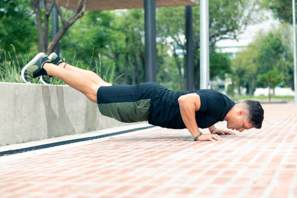 istock Young man exercising outdoors. Sports lifestyle. 1265336054