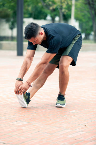 istock Young man exercising outdoors. Sports lifestyle. 1265336091