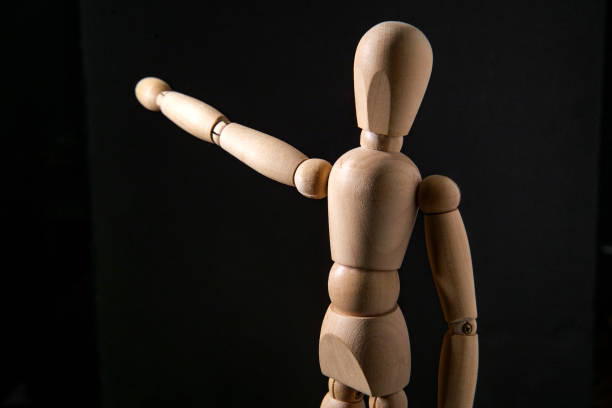 istock Wooden Art Doll Pointing 1265336187